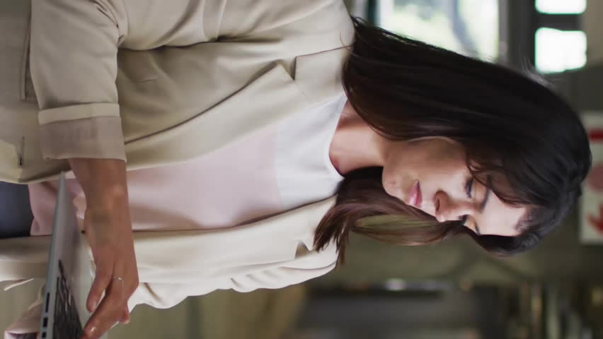 Reading code on laptop, businesswoman in office, data processing animation over video. Technology, coding, professional, working, entrepreneur, digital - Powered by Shutterstock - Get 15% off with code: PIKWIZARD15