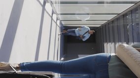 Animation of social media icons over businessman running in airport. Global social media network, business, computing and data processing concept digitally generated video. - Powered by Shutterstock - Get 15% off with code: PIKWIZARD15