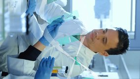 Animation of dna helix over diverse scientists discussing about sample in laboratory. Digital composite, multiple exposure, research, anatomy, molecule, teamwork, medical and healthcare concept. - Powered by Shutterstock - Get 15% off with code: PIKWIZARD15