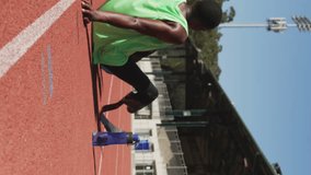 Animation of notification bars over tired african american athlete sitting in race track. Digital composite, multiple exposure, social media reminder, fitness, disability, sports, competition. - Powered by Shutterstock - Get 15% off with code: PIKWIZARD15