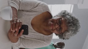 Animation of graphs, map, cloud in laptop over senior african american woman using cellphone. Digital composite, retirement, report, business, global, cloud computing and technology concept. - Powered by Shutterstock - Get 15% off with code: PIKWIZARD15
