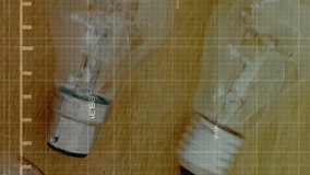 Animation of statistical data processing against close up view of electric bulbs on wooden table. Computer interface and business data technology concept - Powered by Shutterstock - Get 15% off with code: PIKWIZARD15