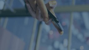 Animation of stock market data processing over mid section of a woman using smartphone at office. Global economy and business data technology concept - Powered by Shutterstock - Get 15% off with code: PIKWIZARD15