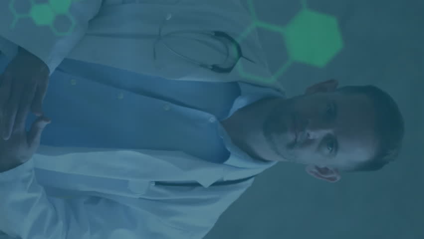 Animation of financial data processing over caucasian male doctor in hospital. Global medicine, connections, computing and data processing concept digitally generated video. - Powered by Shutterstock - Get 15% off with code: PIKWIZARD15