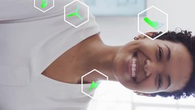 Animation of ecology icons over businesswoman smiling in office. Technology, business and digital interface concept digitally generated video. - Powered by Shutterstock - Get 15% off with code: PIKWIZARD15