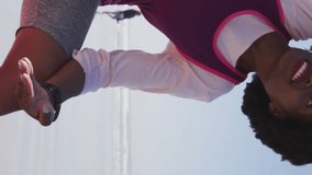 Animation of social media data processing over african american woman stretching on beach. Global fitness, networks, computing, digital interface and data processing concept digitally generated video. - Powered by Shutterstock - Get 15% off with code: PIKWIZARD15