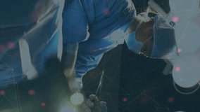 Animation of dna over diverse female and male surgeons during operation. medicine, health, science and technology concept during coronavirus covid 19 pandemic digitally generated video. - Powered by Shutterstock - Get 15% off with code: PIKWIZARD15