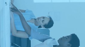 Animation of social media icons with numbers over diverse business people having meeting at office. Global business, social media and digital interface concept digitally generated video. - Powered by Shutterstock - Get 15% off with code: PIKWIZARD15