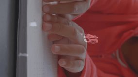 Animation of letters and numbers over caucasian schoolboy reading braille. Disability, school, learning and education concept digitally generated video. - Powered by Shutterstock - Get 15% off with code: PIKWIZARD15