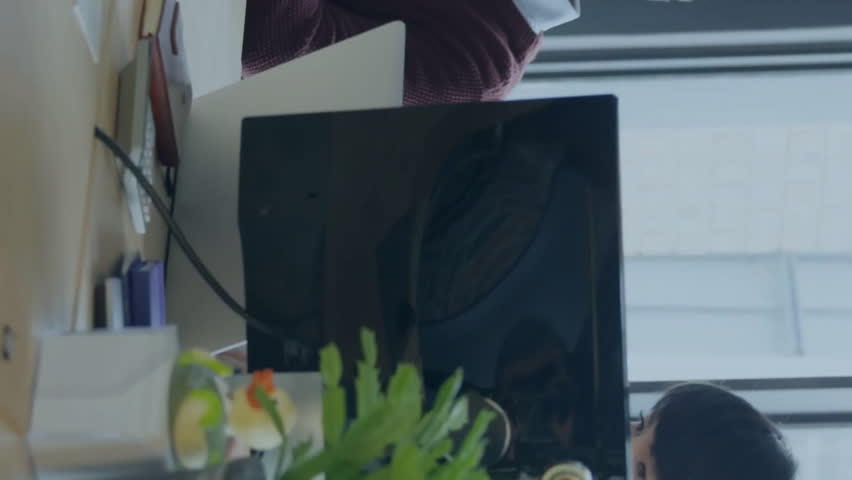 Animation of binary coding data processing over diverse business people in office. Global finance, business, connections, computing and data processing concept digitally generated video. - Powered by Shutterstock - Get 15% off with code: PIKWIZARD15