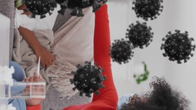 Animation of virus cells over african american woman and her son lying on sofa. Global covid 19 pandemic, medicine and healthcare concept digitally generated video. - Powered by Shutterstock - Get 15% off with code: PIKWIZARD15