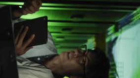 Animation of data processing over diverse male and female engineers working at computer server room. Computer interface and business data storage technology concept - Powered by Shutterstock - Get 15% off with code: PIKWIZARD15