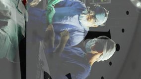 Animation of clock ticking over diverse surgeons in operating theatre. Global healthcare, science, medicine, research, computing and data processing concept digitally generated video. - Powered by Shutterstock - Get 15% off with code: PIKWIZARD15