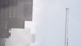 Animation of map and circuit board pattern over crane on under construction building against sky. Digital composite, multiple exposure, business, global, power supply and architecture concept. - Powered by Shutterstock - Get 15% off with code: PIKWIZARD15