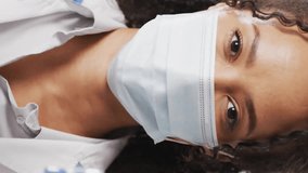 Animation of dna strand over african american female doctor holding vial and syringe. Global medicine, healthcare and science concept digitally generated video. - Powered by Shutterstock - Get 15% off with code: PIKWIZARD15