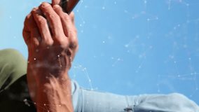 Animation of connections with icons over caucasian man using smartphone. Connections, networks, data processing and technology concept digitally generated video. - Powered by Shutterstock - Get 15% off with code: PIKWIZARD15