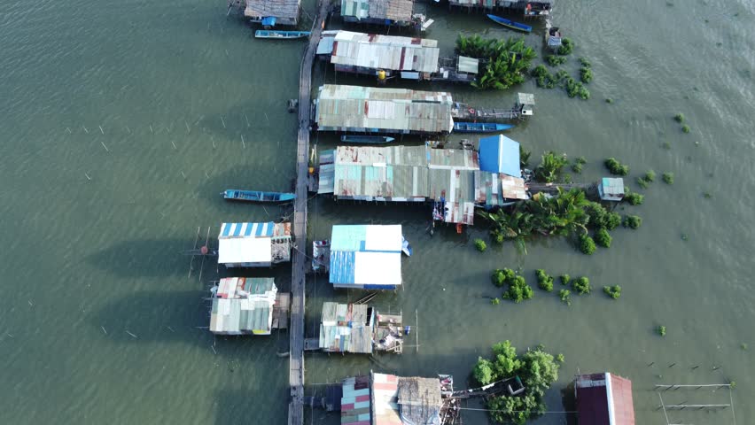 A traditional stilt house on a river. A traditional fishing house on Karaka Island, Papua.
