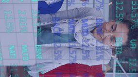 Animation of stock market data processing over team of diverse fashion designers using laptop. Global economy and technology concept - Powered by Shutterstock - Get 15% off with code: PIKWIZARD15