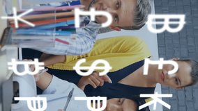 Animation of currency symbols against diverse colleagues discussing together over a laptop at office. Global economy and business technology concept - Powered by Shutterstock - Get 15% off with code: PIKWIZARD15