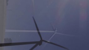 Animation of financial data processing over wind turbines. Global environment, wind energy, business, finance, computing and data processing concept digitally generated video. - Powered by Shutterstock - Get 15% off with code: PIKWIZARD15