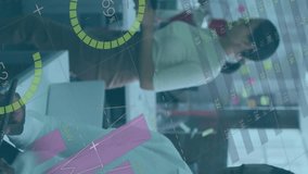 The african american businessman is sitting at a desk in an office, using a tablet and looking towards the camera. Global shipping delivery business data processing and technology concept digitally - Powered by Shutterstock - Get 15% off with code: PIKWIZARD15