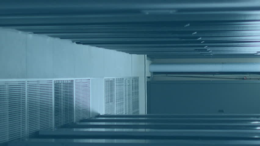 Animation of multicolored computer language over data server racks in server room. Digital composite, programming language, coding, data center, networking, technology and network server concept. - Powered by Shutterstock - Get 15% off with code: PIKWIZARD15