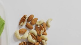 Social media likes animation over healthy lunch with nuts, sandwich, and fruits. healthy eating, wellness, nutrition, balanced diet, engagement, online interaction - Powered by Shutterstock - Get 15% off with code: PIKWIZARD15