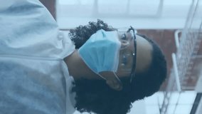 Healthcare worker wearing mask and goggles with social media notifications animation. safety, medical, technology, communication, digital, protection - Powered by Shutterstock - Get 15% off with code: PIKWIZARD15