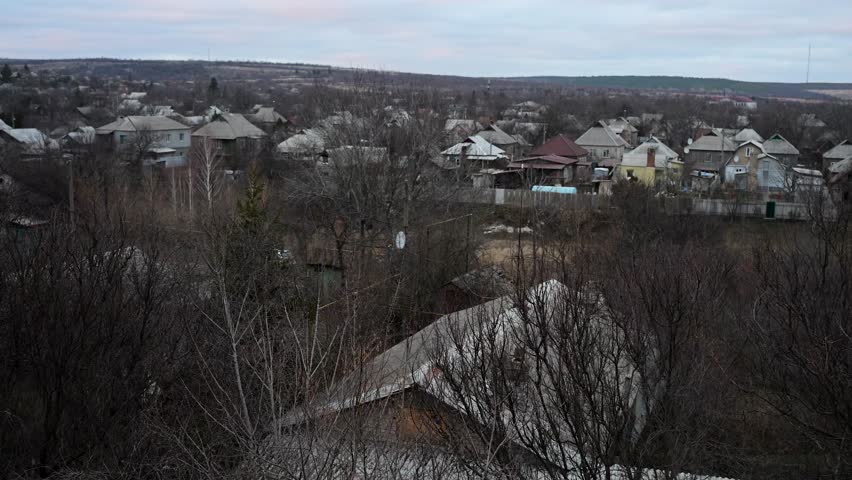 A poignant contrast in Ukraine's Donbas region. The sun sets over a village, casting a beautiful light on a landscape that has endured the harsh realities of war.