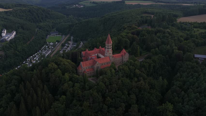 Clervaux, the Abbey of Saint Maurice and Saint Maur, plus the small mountain village setting in northern Luxembourg. Aerial view.