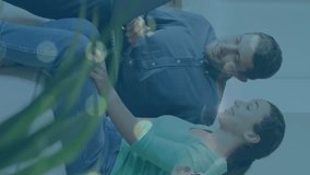 Animation of statistical data processing over caucasian couple kissing each other at home. Global networking and business data technology concept - Powered by Shutterstock - Get 15% off with code: PIKWIZARD15