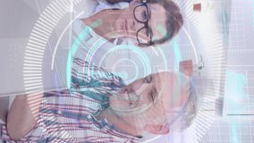 Animation of data processing over caucasian male ad female fashion designers discussing at office. Computer interface and creative business technology concept - Powered by Shutterstock - Get 15% off with code: PIKWIZARD15