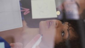 Animation of media icons over diverse colleagues taking notes in office. Global business, teamwork and digital interface concept digitally generated video. - Powered by Shutterstock - Get 15% off with code: PIKWIZARD15