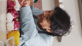 Cutting vegetables in kitchen, social media likes and comments animation over scene. Cooking, culinary, interaction, engagement, food preparation - Powered by Shutterstock - Get 15% off with code: PIKWIZARD15