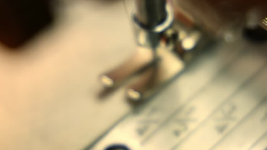 Tailoring process in fashion studio: sketching on paper and fabric, cutting with scissors, sewing button by hand, close-up of sewing machine foot.