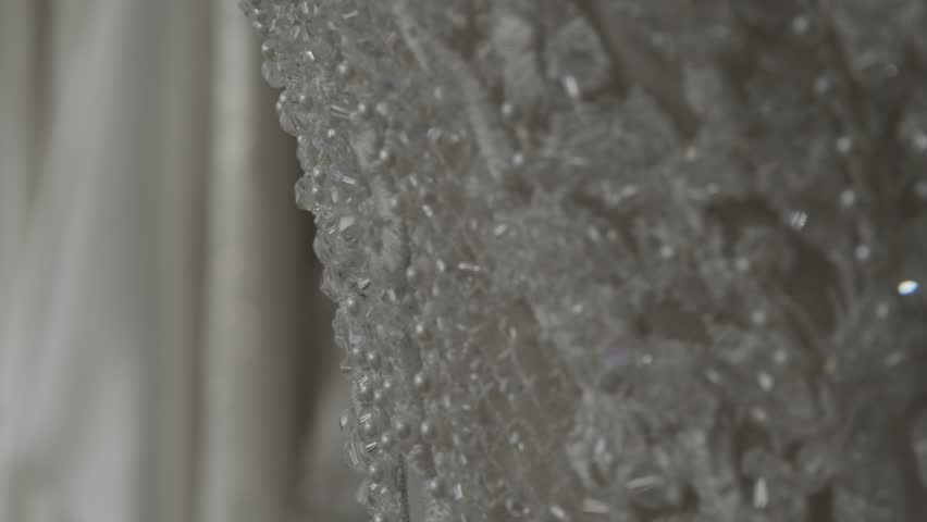 a close-up look at a wedding dress in a wedding salon.