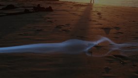 Travel ad showing wisp drifting on dusk shore leading walker following smoke weaving around feet. Mystical, ethereal, landscape, serenity, silhouette, tranquil, nature - Powered by Shutterstock - Get 15% off with code: PIKWIZARD15