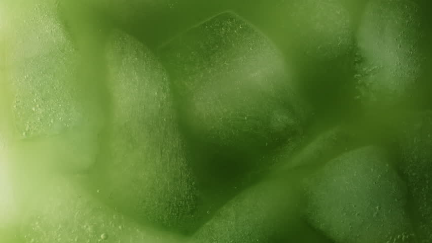 Super Slow Motion Detail Shot of Pouring Cream into Matcha Latte at 1000fps.