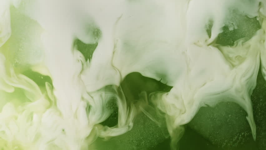 Super Slow Motion Detail Shot of Pouring Cream into Matcha Latte at 1000fps.