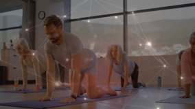 Fitness instructor signalling start guiding seniors in spine warmup with glowing digital overlay. Wellness, senior fitness, digital technology, exercise, mindfulness, health, active aging - Powered by Shutterstock - Get 15% off with code: PIKWIZARD15