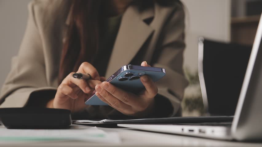 Shot of a businessman and businesswoman using a laptop and digital tablet during a meeting in a modern office
