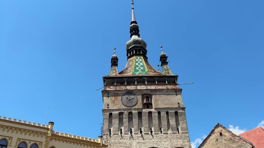Medieval clock tower of Sighisoara city. Panning view