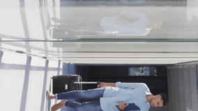 Animation of financial data processing over diverse business people at airport. Global finance, business, connections, computing and data processing concept digitally generated video. - Powered by Shutterstock - Get 15% off with code: PIKWIZARD15