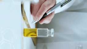 Animation of data processing and chemical formula over caucasian male scientist doing experiment. Science and digital interface concept digitally generated video. - Powered by Shutterstock - Get 15% off with code: PIKWIZARD15