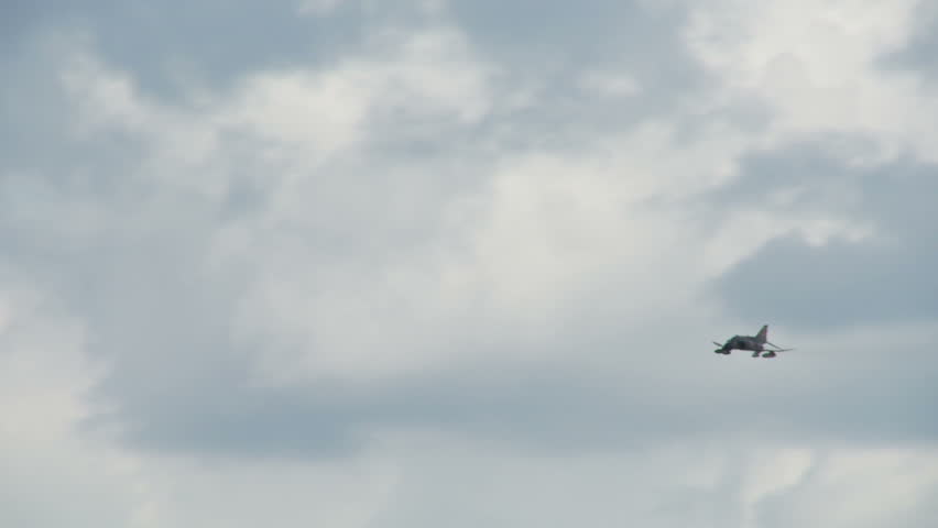 McDonnell Douglas F-4 Phantom jet fighter, flying through a series of rolls.