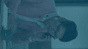 Analyzing financial data and talking on phone, businessperson over stock market animation. Finance, analytics, trading, communication, technology, investment - Powered by Shutterstock - Get 15% off with code: PIKWIZARD15