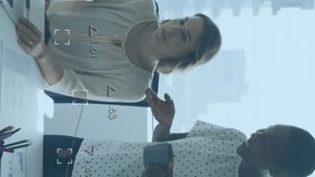 Financial data processing animation over two businesswomen discussing in modern office. teamwork, collaboration, technology, finance, analysis, corporate - Powered by Shutterstock - Get 15% off with code: PIKWIZARD15