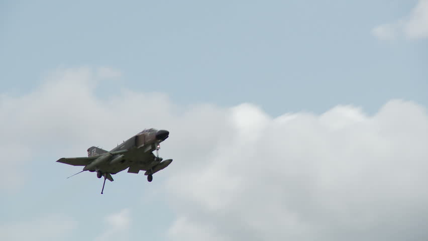 McDonnell Douglas F-4 Phantom jet fighter, flying past at slow speed.