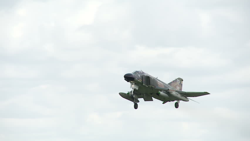 McDonnell Douglas F-4 Phantom jet fighter, landing at airfield.  Originally