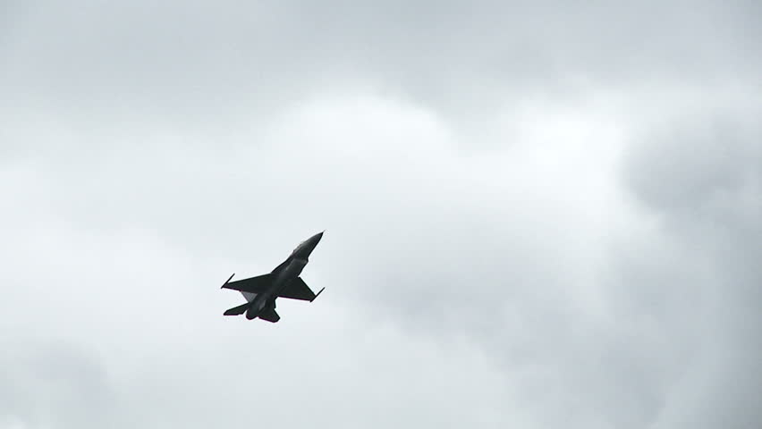 General Dynamics F-16 Fighting Falcon jet fighter in flight, climbing.  Recorded